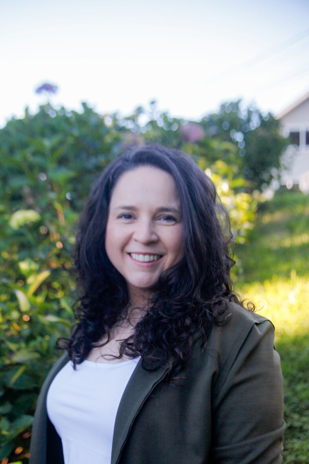 Carolina Casas-Cordero smiling in a garden